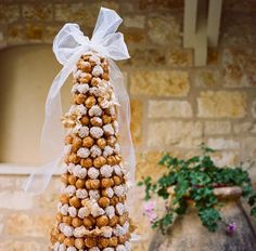 there is a tall tower made out of cookies and candy on top of a table