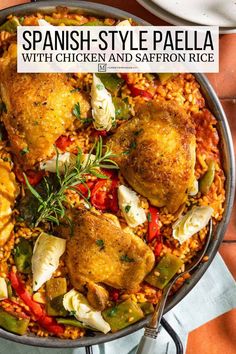 spanish - style paella with chicken and saffroni rice in a skillet