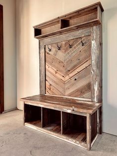 a bench made out of wooden planks in a room