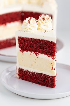 a slice of red velvet cake with white frosting