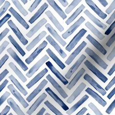 blue and white watercolor chevroned pattern with diagonal lines on the fabric background