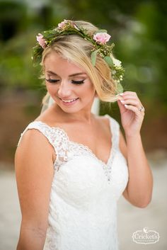 a woman wearing a flower crown on her head