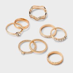 8-piece band ring set from Wild Fable™ includes a variety of designs that range from a simple band to textured to stone studded and more. Made with gold-tone metal. Perfect for everyday wear or special occasions. Wild Fable™: A look for every story. If you're not satisfied with any Target Owned Brand item, return it within one year with a receipt for an exchange or a refund. Set Of Gold Hoops Target, Good Rings, Gold Tarnish-resistant Stackable Rings, Hot Topic Ring Set, Gold Hello Kitty Ring, Target Ring, Women Money, Simple Band, Grown Women