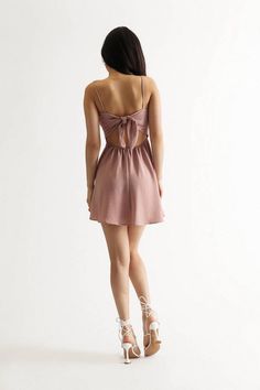 "Up Your Style Game With The Gabbie Ruched Tie Back Skater Mini Dress. With A Square Neckline And Ruched Bust, This Skater Dress Is Oh-So Flattering. The Flowy Skirt And Cami Straps Give This Dress A Feminine Touch, While The Open Back Details And Adjustable Back Tie Add A Touch Of Sultriness. Whether You'Re Headed To Brunch With The Girls Or A Date Night, This Dress Is Sure To Turn Heads." Skater Mini Dress, Mini Skater Dress, Flowy Skirt, Square Necklines, Tie Backs, Tie Back, Skater Dress, Square Neckline, Open Back