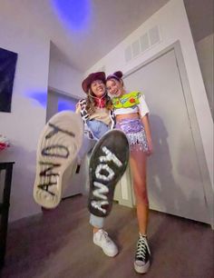 two young women are posing with their skateboards