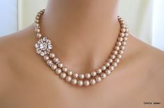 "This elegant necklace has a rose gold pendant with clear rhinestone and Swarovski pearls in chamopagne color. Pendant is enhanced with some Swarovski crystals for extra sparkle! Necklace measures approximately 17\" long inner strand with 2\" extender chain for additional length. Pearls measure 8 mm accented with rhinestone rondelles. Pendant is about 1\" in diameter. Finished off with a filigree and lobster clasp closure. Size can be adjusted up to 18\" without extra charge if specified at the Bridal Jewelry Pearl, Jewelry Pearl Necklace, Bridal Bracelet Pearl, Bridal Earrings Studs, Bridal Pearl Necklace, Pearl Necklace Wedding, Sparkle Necklace, Gold Embellishment, Necklace Bridal