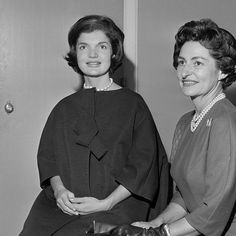 two women sitting next to each other in black and white