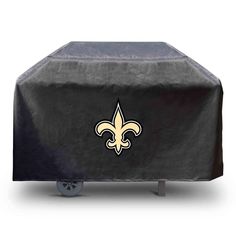 the new orleans saints grill cover is shown on top of an outdoor bbq table