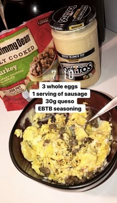 an image of scrambled eggs in a bowl with yogurt and other ingredients on the counter