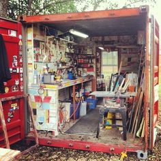 the inside of a storage shed with tools and other items in it's compartment