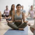 a group of people doing yoga in a room