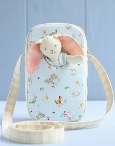 a small bag with an elephant on it's back and a strap around the shoulder