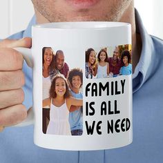 a man is holding a coffee mug with family pictures on it and the words, family is all we need