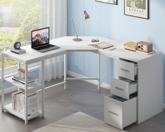 a computer desk with a laptop on top of it next to a book shelf and file cabinet