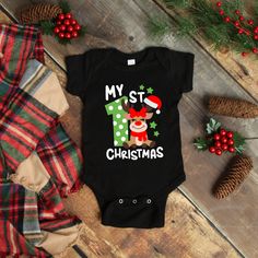 Everyone loves babies 1st Christmas; this onesie® is so cute and will be the talk of any holiday event on your baby boy or baby girl. Onesie® comes in four colors Black, Gray, Red & White and sizes of your choice. We use high quality, soft flex vinyl which not only creates a sharp, vivid graphic but will never look "faded" or “washed out” like some inks commonly do. Processing time is 2-4 days, delivery will depend on your choice at checkout First Class Mail 5-7 days, Priority Mail 2-4 days & Pr Christmas Onsies, Reindeer Onesie, My 1st Christmas, Christmas Onesie, Twin Outfits, Baby Boy Onesies, Holiday Baby, Funny Outfits, Family Christmas Shirts