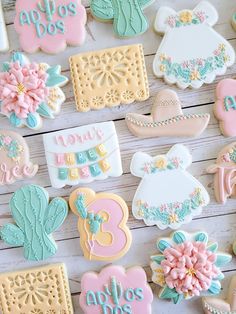 some decorated cookies are laying on a table