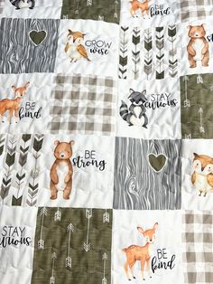 a baby quilt with animals and words on it