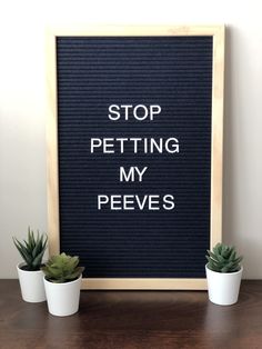 a sign that says stop petting my peeves next to some succulents