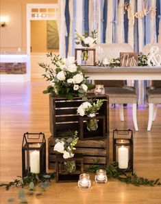 a table with candles and flowers on it