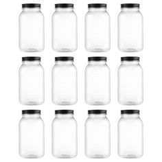 twelve clear glass jars with black lids