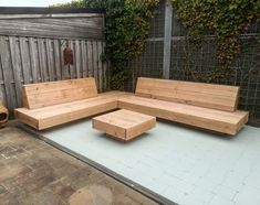 a wooden bench sitting on top of a patio