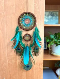 a wooden door with a blue and green dream catcher hanging on it