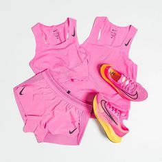 a pair of pink nike running shorts and sneakers