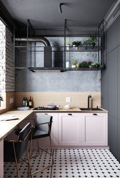 a kitchen with black and white tile flooring