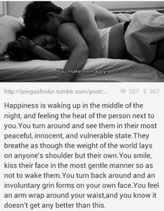 a woman laying in bed with her head on the pillow and texting that reads, happiness is waking up in the middle of the