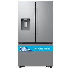 a silver refrigerator freezer sitting on top of a white counter next to a blue sign that says mega capacity