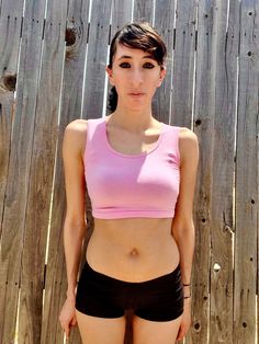 "This form-fitting pink crop top / cropped tank top is made from a stretchy cotton spandex fabric.   Best paired with: Jeans, cutoff shorts, yoga pants, or your favorite mini-skirt. The model is 5'6\" and wearing a size small. The fabric is stretchy and adjusts to the shape of your body. Size Chart (inches):                              S            M           L Bust                      26-30 30-34    34-36 Natural Waist        23            24    26 Length                       12             13     14  Materials:  95% cotton, 5% spandex. Custom print on this crop top: Yes. You can request your own design on this crop top. There is a $16 custom design fee added to the price of the top. Local Pickup Available: Yes.  If you live in the south bay area in San Diego, you can pick up your cro Home Clothes Women, Belly Shirt, Belly Top, Crop Tops For Women, Belly Shirts, Cutoff Shorts, South Bay, Pink Crop Top, Cropped Tops