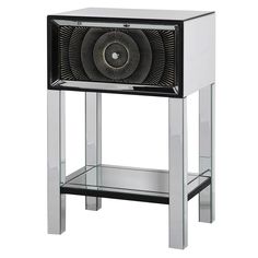 a black and silver cabinet with a fan on it's front shelf, against a white background