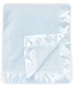 a blue and white blanket folded on top of each other