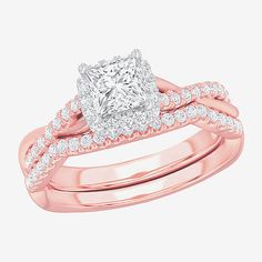 a rose gold engagement ring set with a princess cut diamond in the center and two rows of diamonds on each band