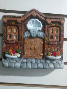 there is a small house made out of clay