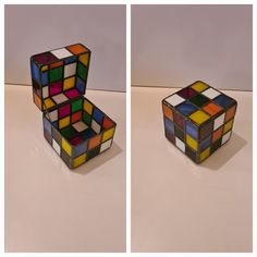 two different views of a rubik cube on a white surface, one with multicolored squares