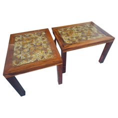 two wooden tables with tile top sitting side by side on white background, one is brown and the other is gold