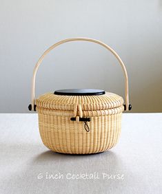 a wicker basket sitting on top of a table