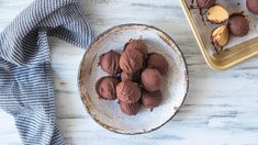 chocolate truffles in a bowl on a table