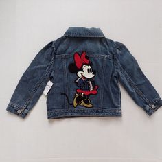 NEW Tags Baby Gap Disney Jean Jacket Minnie Mouse Toddler Girl 4T Denim Ltd Ed  New with tags; unused; unworn Baby Gap Disney Minnie Mouse Applique Button down denim jacket with pockets 3-season Size 4T Measurements Sleeve - 13"l  Chest - 24" Length - 14"l Weight - 12 oz Ships FAST Miki Mouse, Custom Jean Jacket, Mickey Mouse And Minnie Mouse, Gap Denim Jacket, Disney Jacket, Embroidered Jean Jacket, Kids Denim, Gap Jacket, Gap Jackets