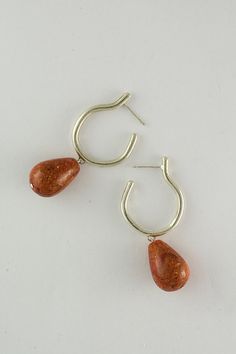 A pair of gorgeous sponge coral hoop earrings. Clean lines with ruff texture, a play of minimalism with statement, classy with a twist- all these together makes this gorgeous pair of silver/gold dangle hoops earrings with dangle coral bead to the best pair of everyday unique statement dangle earrings. ----------------------------------------------------- > Sponge coral dangle hoop earrings > Available in sterling silver, 18k gold plated brass and 14k solid gold. > More gemstone hoops he Sterling Silver Drop Hoop Earring, Sterling Silver Single Drop Hoop Earring, Modern Red Teardrop Jewelry, Modern Red Hoop Jewelry, Minimalist Natural Stone Teardrop Earrings, Silver Long Earrings, Silver Gold Earrings, Organic Earrings, Red Coral Earrings