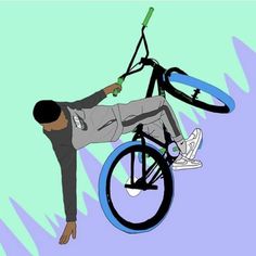 a man on a bicycle doing tricks in the air with his bike wheel attached to it