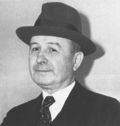 a black and white photo of a man wearing a hat with the words johnny torro on it