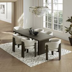 a dining room table with white chairs and a chandelier