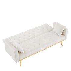 a white couch sitting on top of a wooden frame