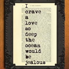 a framed book page with the words i crave a love so deep the ocean would be jellous