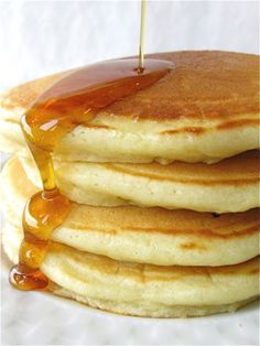 stack of pancakes with syrup being poured onto them and the caption reads pancakes are a sponge for syrup