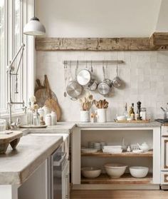 a kitchen filled with lots of pots and pans