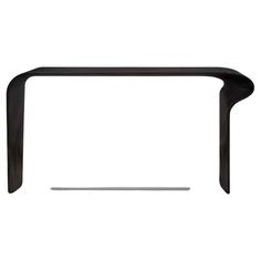 a black table with a white background and an object in the middle that is shaped like a curve