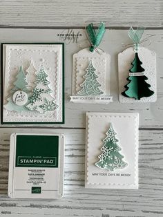 stampin's christmas cards and tags are laid out on a table